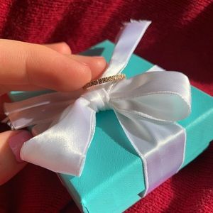 A beautiful 18k rose Gold all around diamond band.